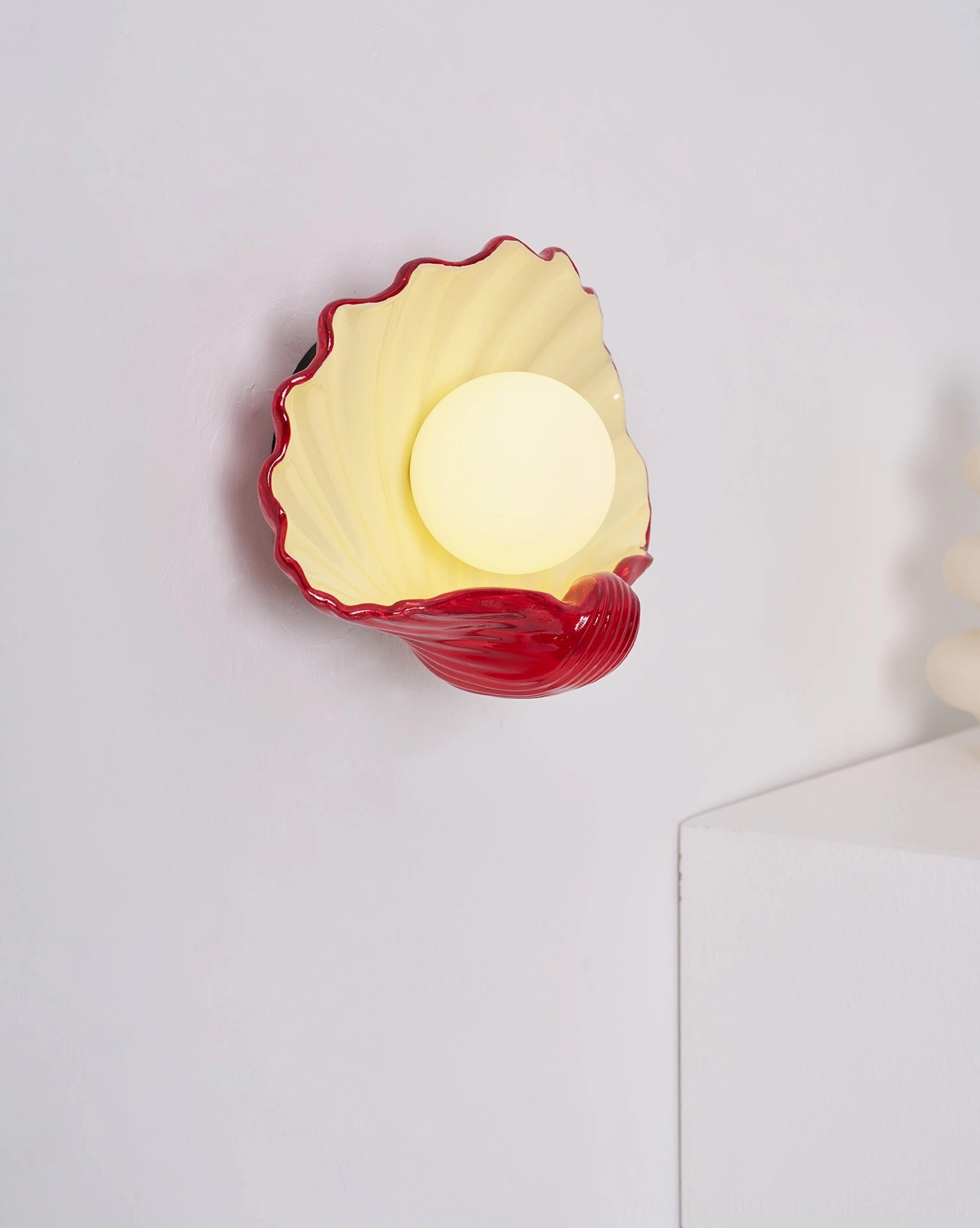 Ceramic scallop shell wall lamp product showcase, sculptural coastal design, matte finish two-tone fixture