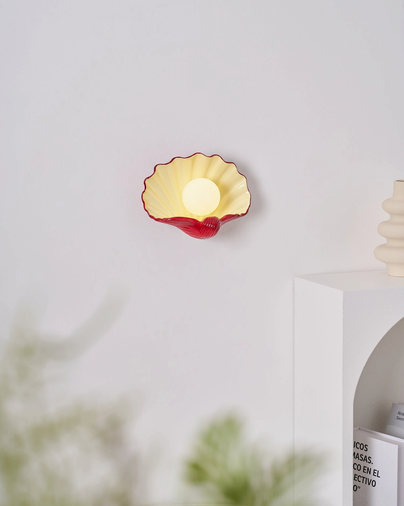 Ceramic scallop shell wall sconce in neutral coastal home, sculptural lighting accent, farmhouse aesthetic fixture