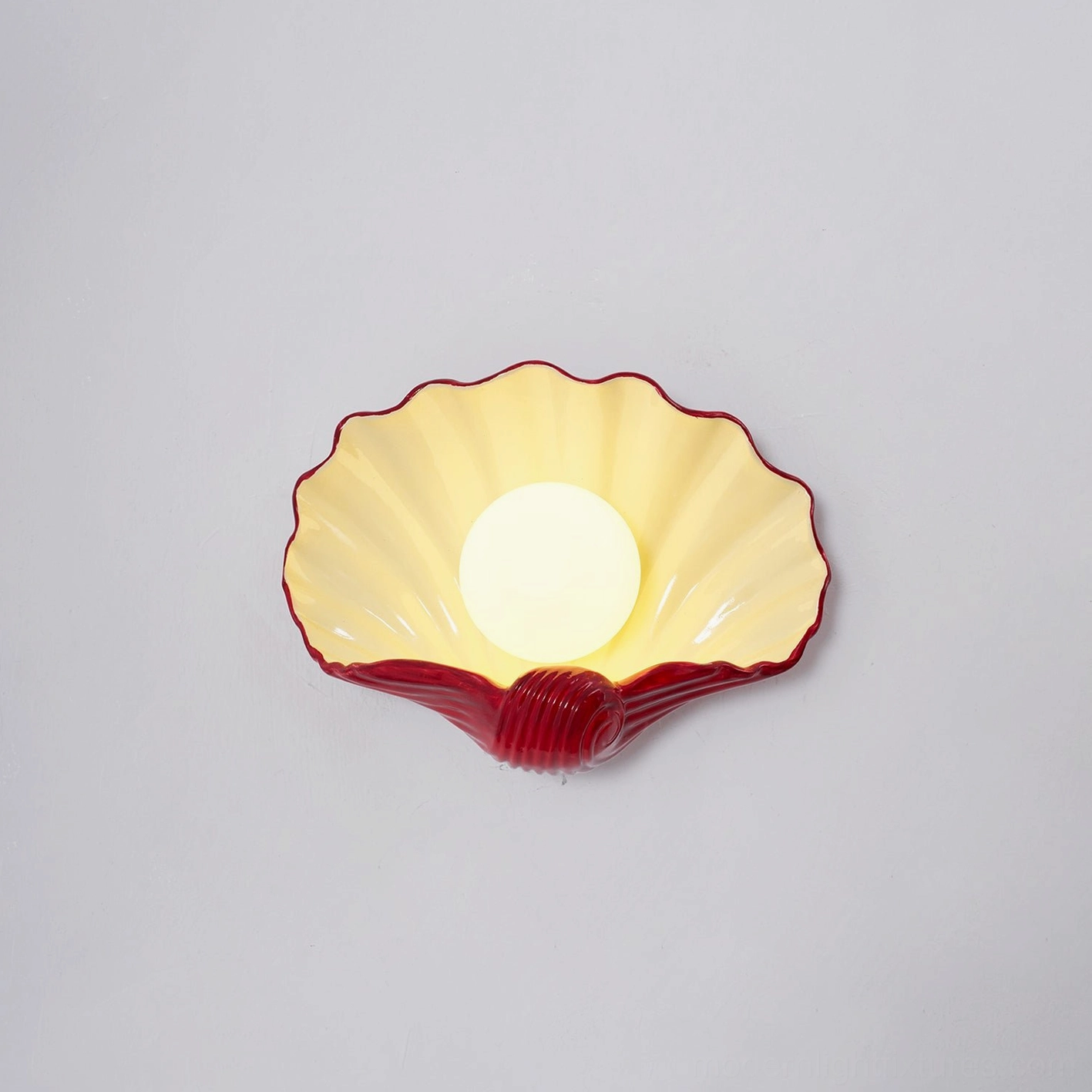 Ceramic scallop wall sconce artistic lighting design, sculptural form with rippled texture, contemporary fixture
