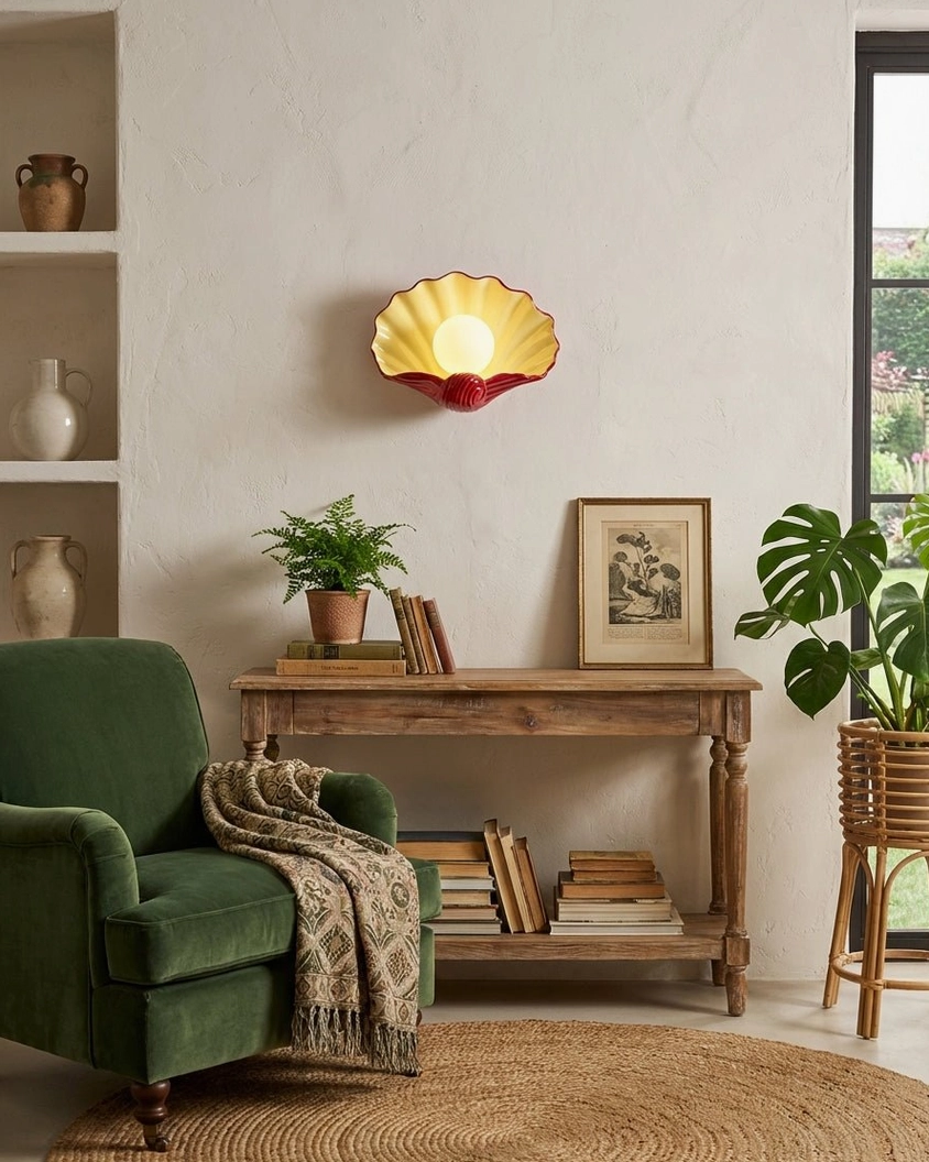 Ceramic scallop shell wall sconce side profile view, sculptural ridged texture and rounded shape, design detail