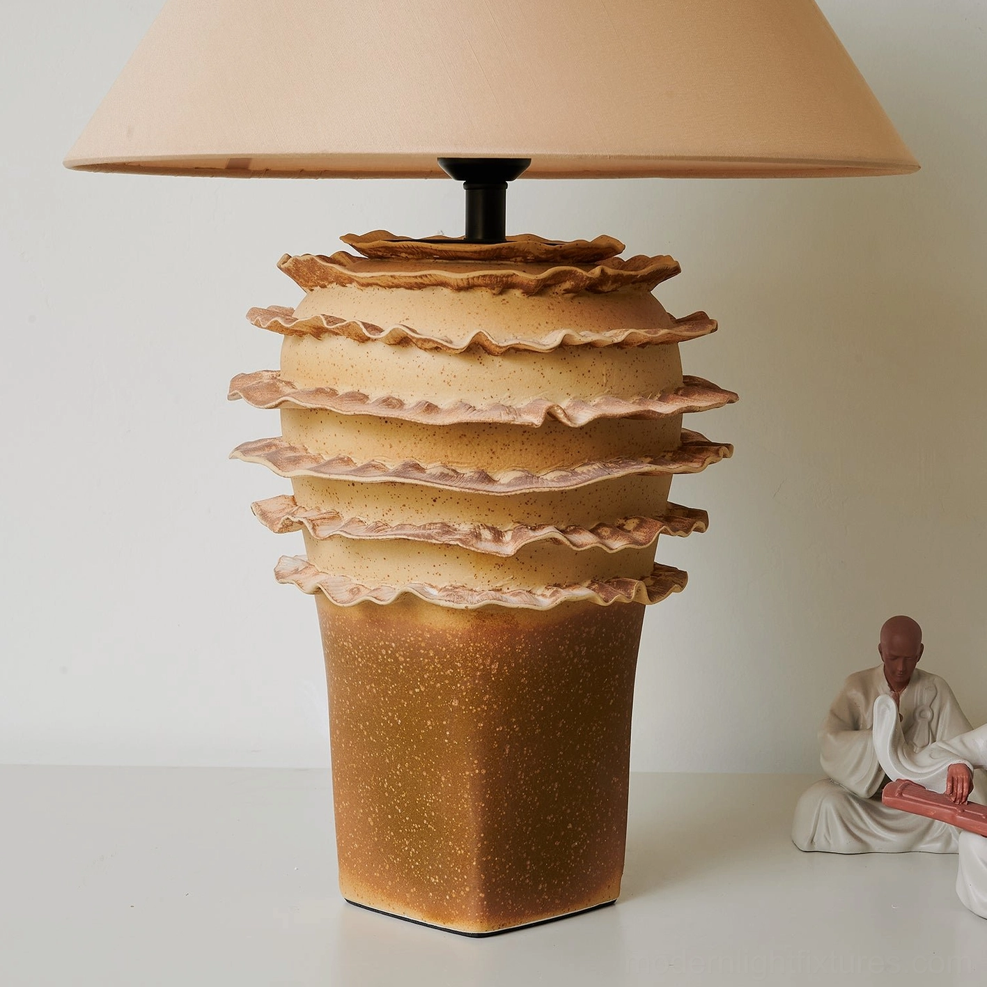Ceramic layered table lamp with biomorphic design inspiration and geological formations aesthetic