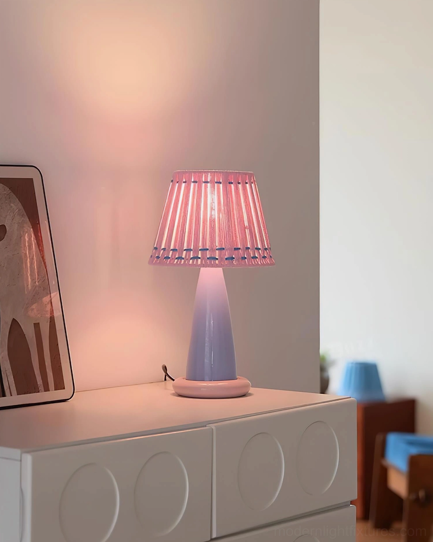 Ceramic table lamp styled in contemporary living room setting, demonstrating modern minimalist interior design aesthetic