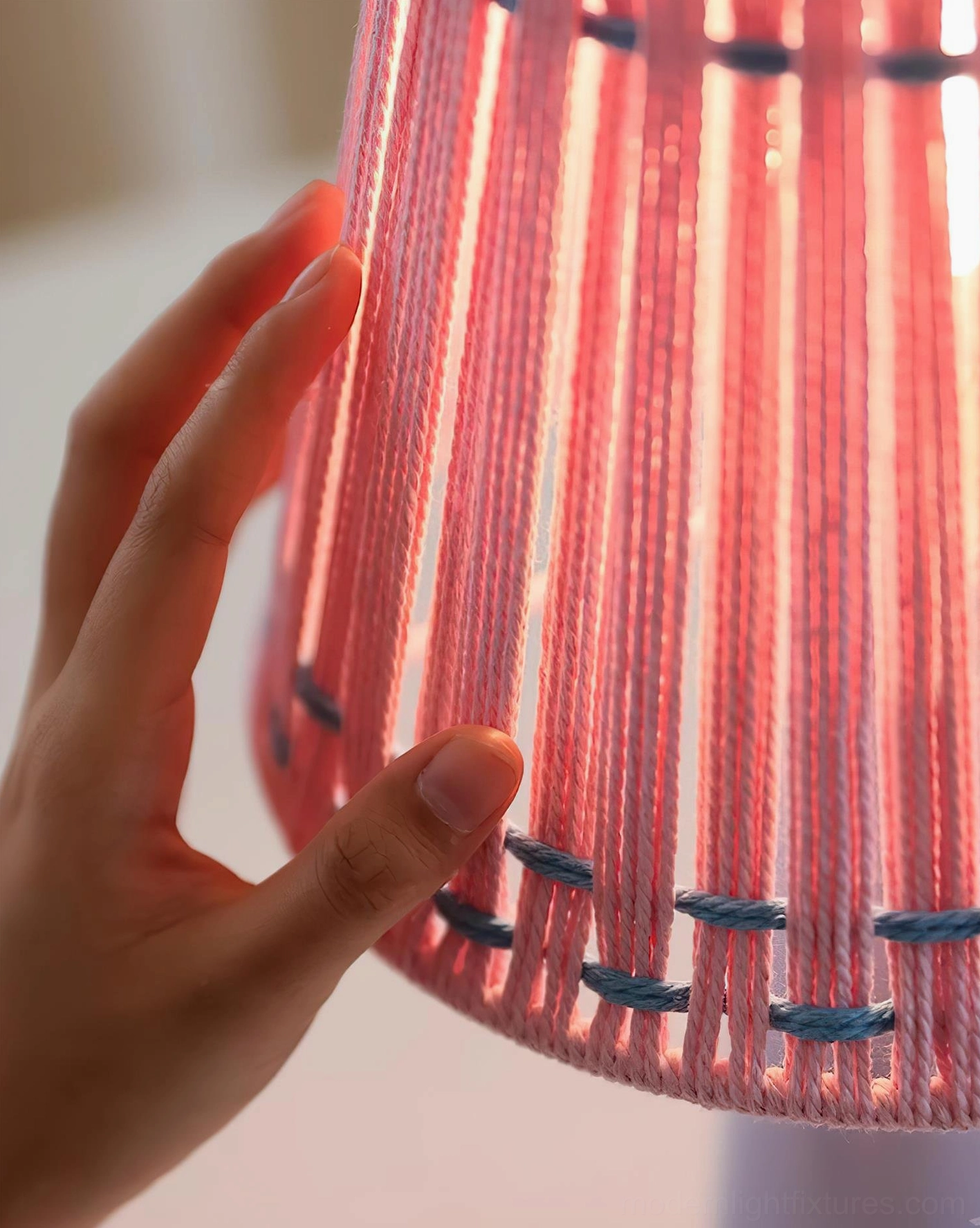 Ceramic table lamp close-up detail showing glazed ceramic base texture and woven fabric shade construction