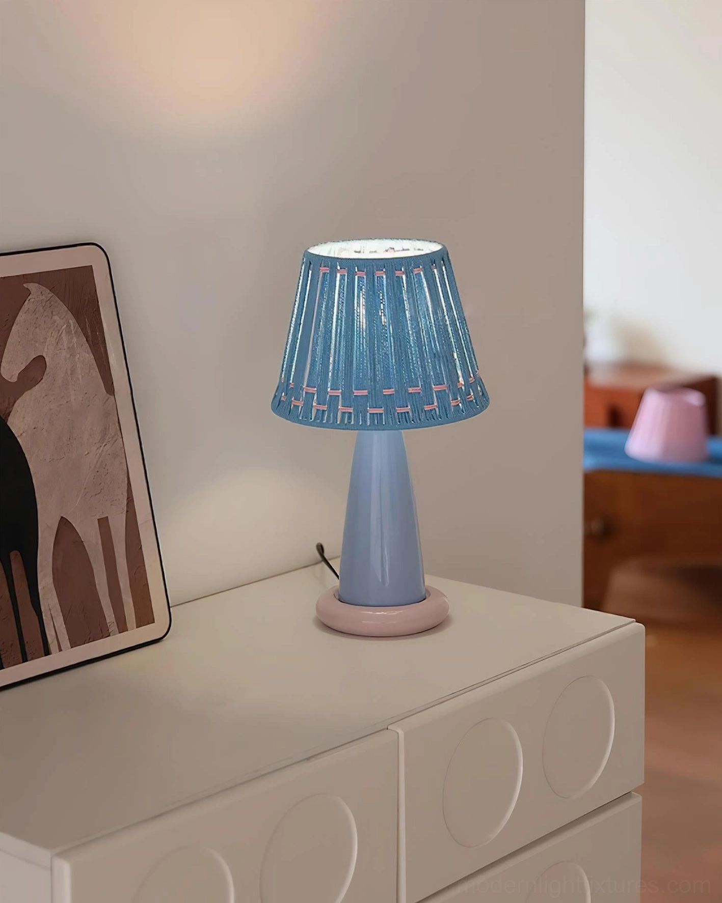 Soft-lit ceramic table lamp creating warm ambient glow, perfect for Scandinavian and minimalist home design styles
