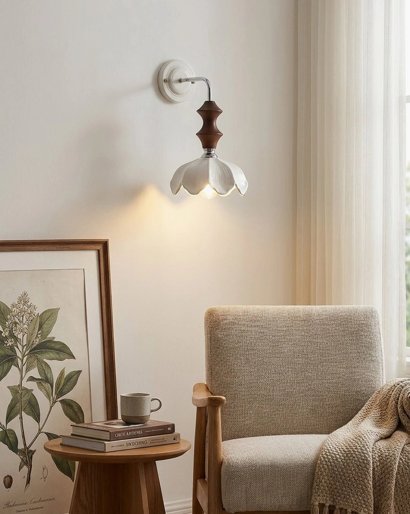 Wall-mounted ceramic sconce accent light beside modern accent chair in cozy reading corner