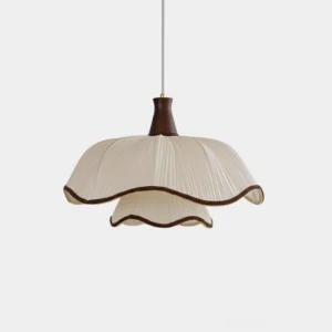 Ceriva ruffled fabric pendant lamp front view, cream pleated shade with walnut trim, studio lighting