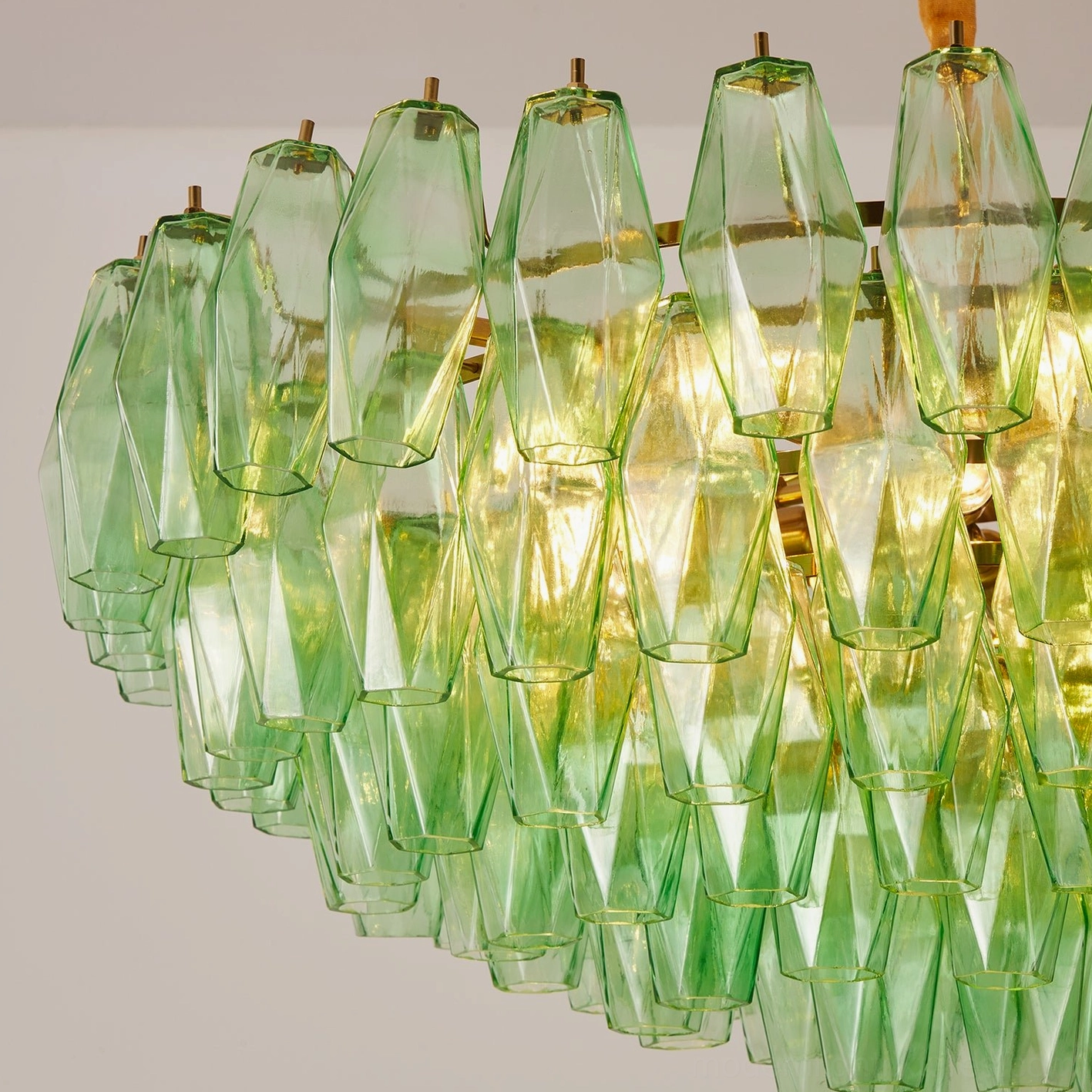 Modern chandelier installation view showing hardwired setup in ceiling and hanging height adjustment