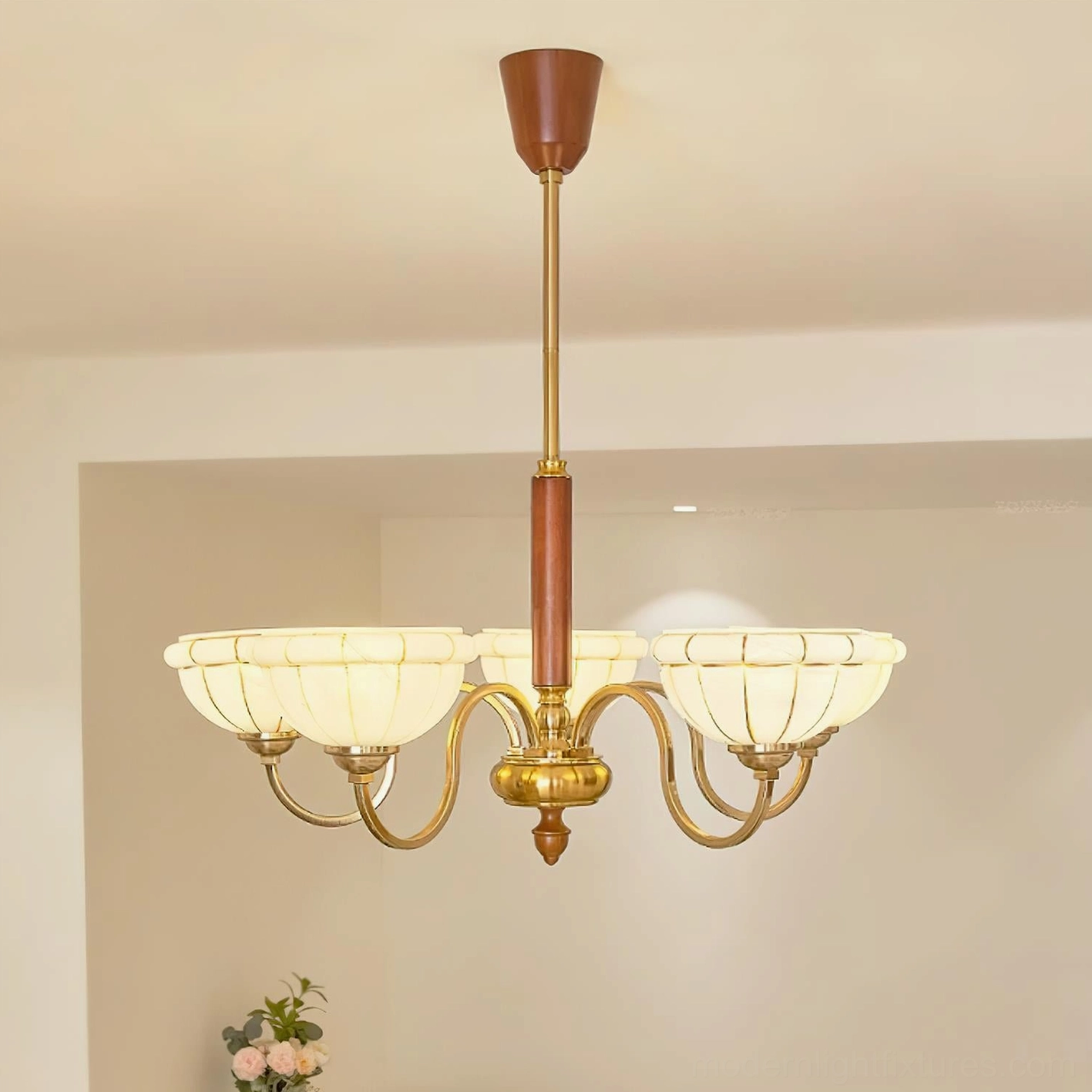 Charlie chandelier eight-head configuration with extended brass arms and complete fixture assembly