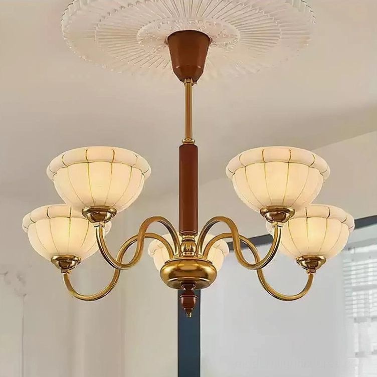 Five-head Charlie chandelier in warm gold brass with walnut wood pole and frosted flower-shaped shades