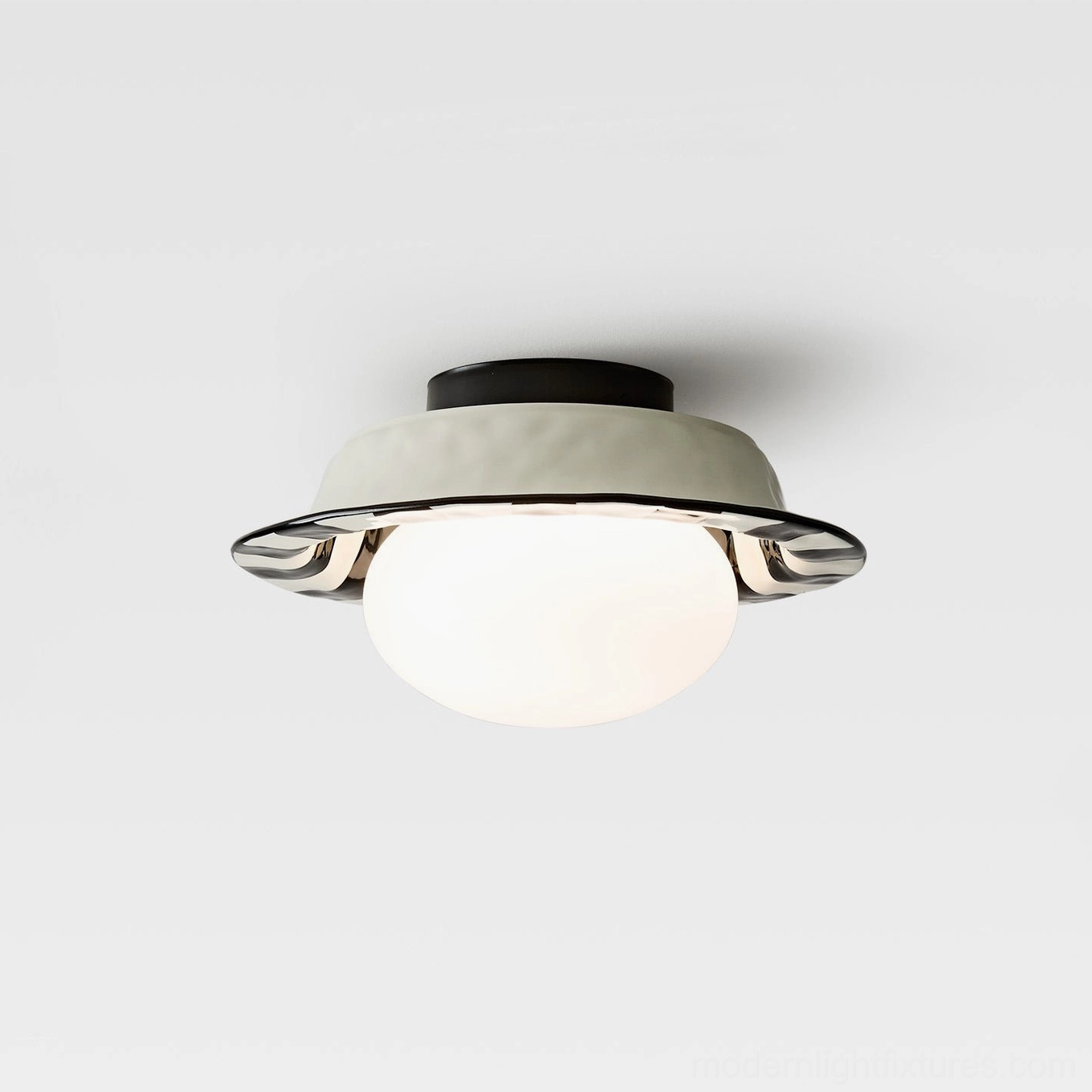 Checker ceiling lamp lit close-up view showing black ceiling mount base and warm light glow from spherical shade