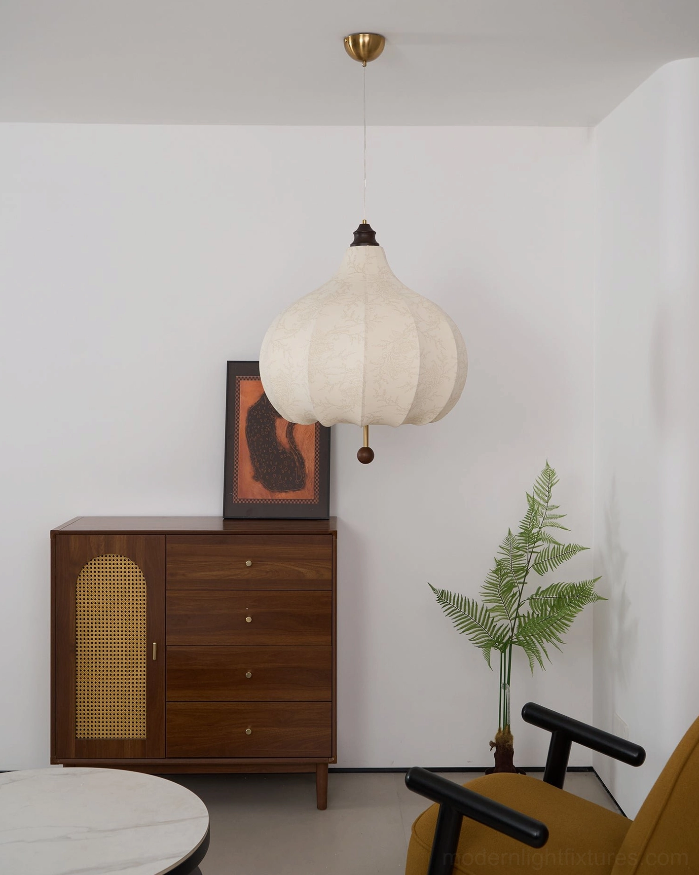 Botanical pendant light illustrating how to style with complementary interior elements and accessories
