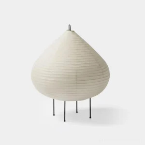 Chestnut modern table lamp with ribbed washi paper shade and black metal tripod legs, front view on white background