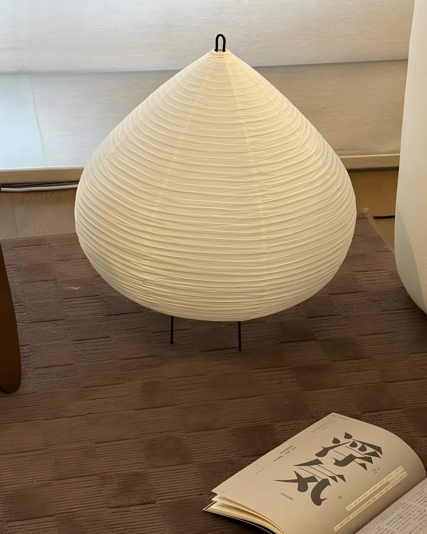 Chestnut modern table lamp lifestyle shot showing warm glowing light in contemporary home setting