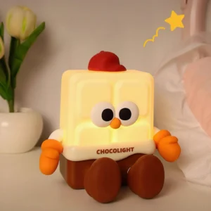 Chocolate bar night light illuminated on bedroom bedside table with tulip vase and warm ambient glow