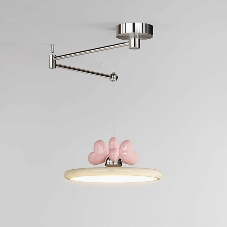 Chrome and beige swing arm pendant lamp with pink heart bow - warm minimalist home lighting solution