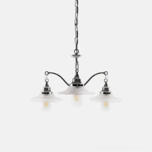 3-head modern chrome chandelier with ribbed clear glass shades and exposed Edison bulbs, studio shot