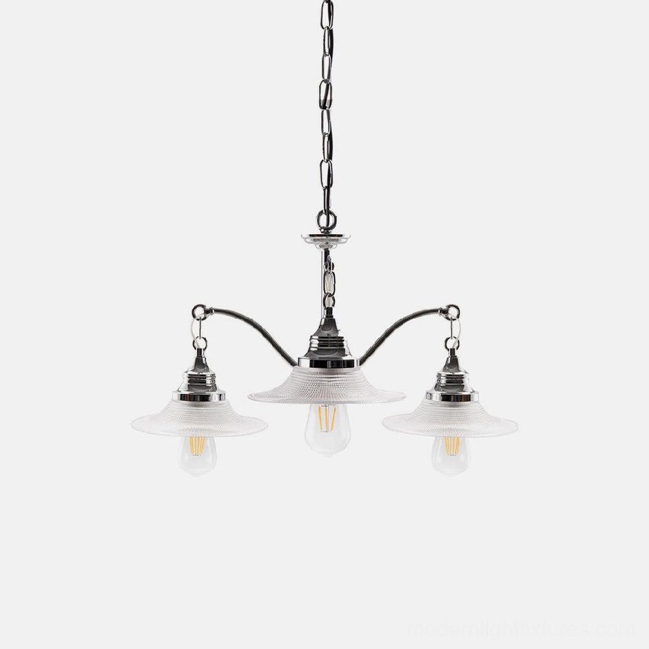 3-head modern chrome chandelier with ribbed clear glass shades and exposed Edison bulbs, studio shot
