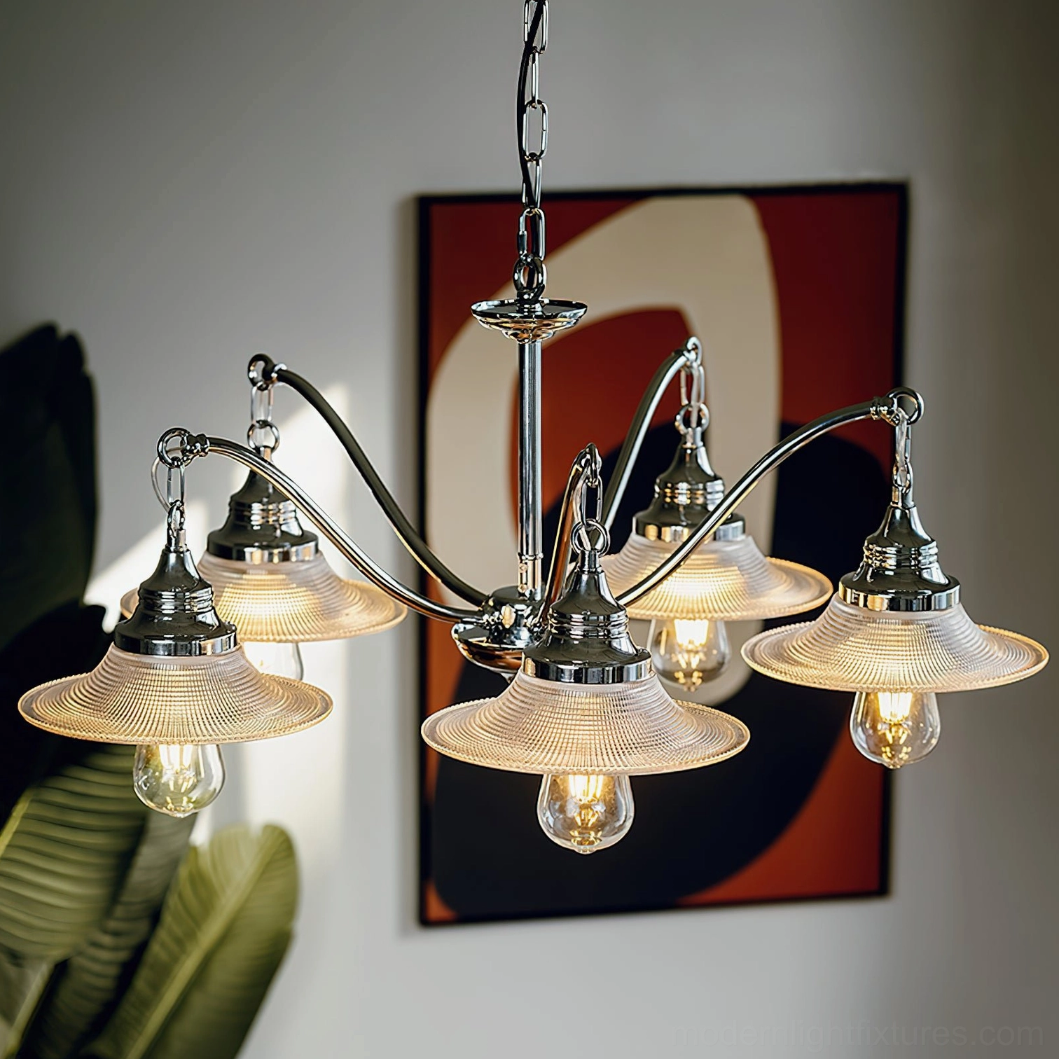 5-head modern chrome chandelier mounted in contemporary home with polished curved arms and fluted glass shades