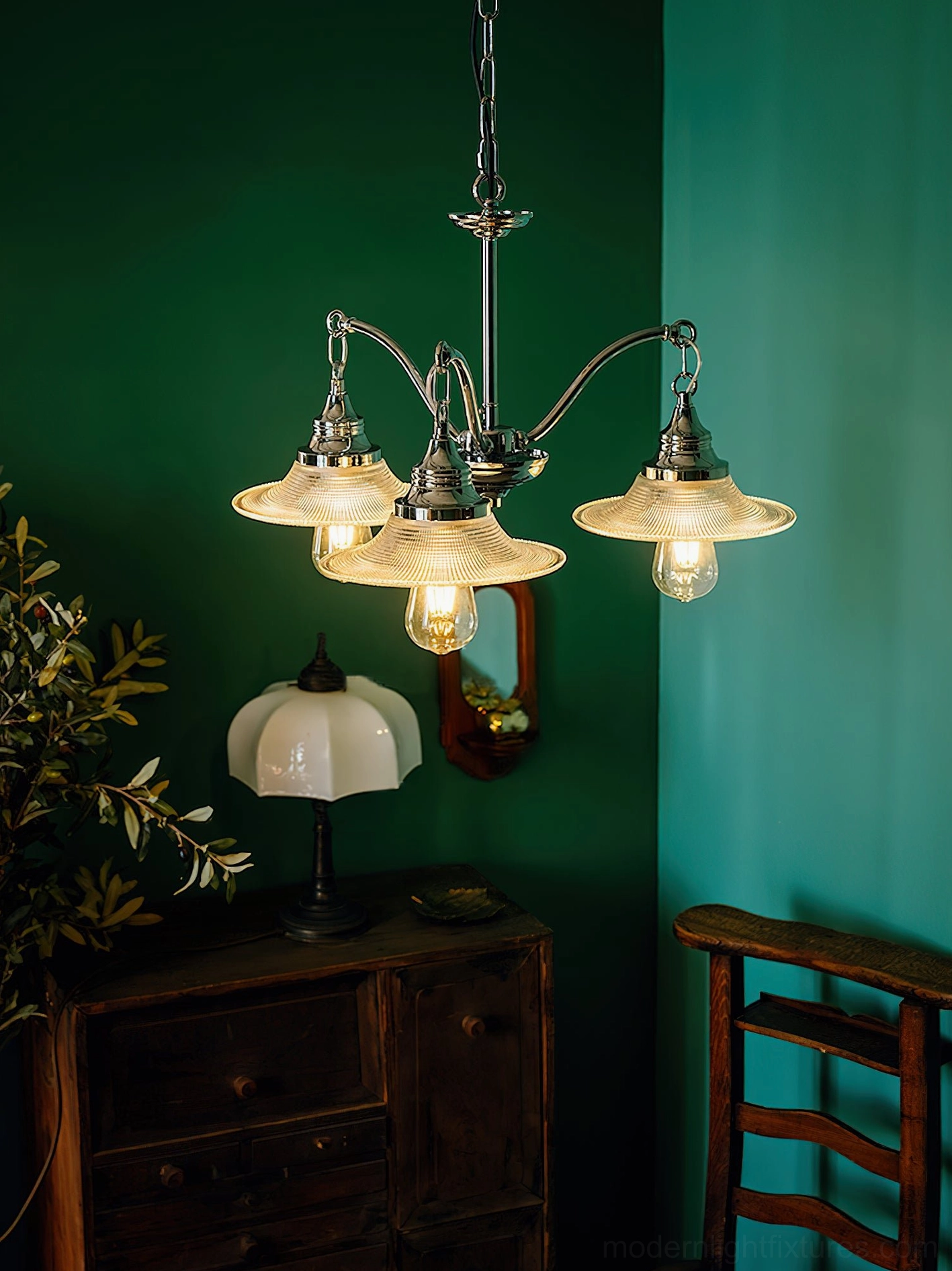 5-head chrome pendant chandelier with ribbed glass shades in vintage home corner with wall art