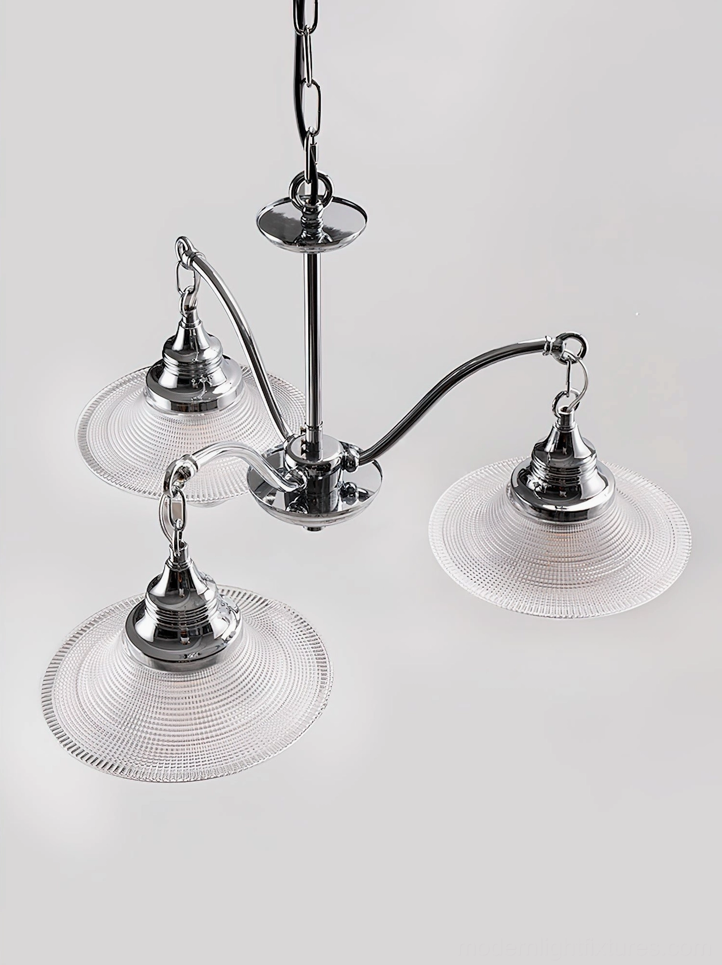 Modern chrome chandelier installation example in elegant dining room with warm ambient lighting