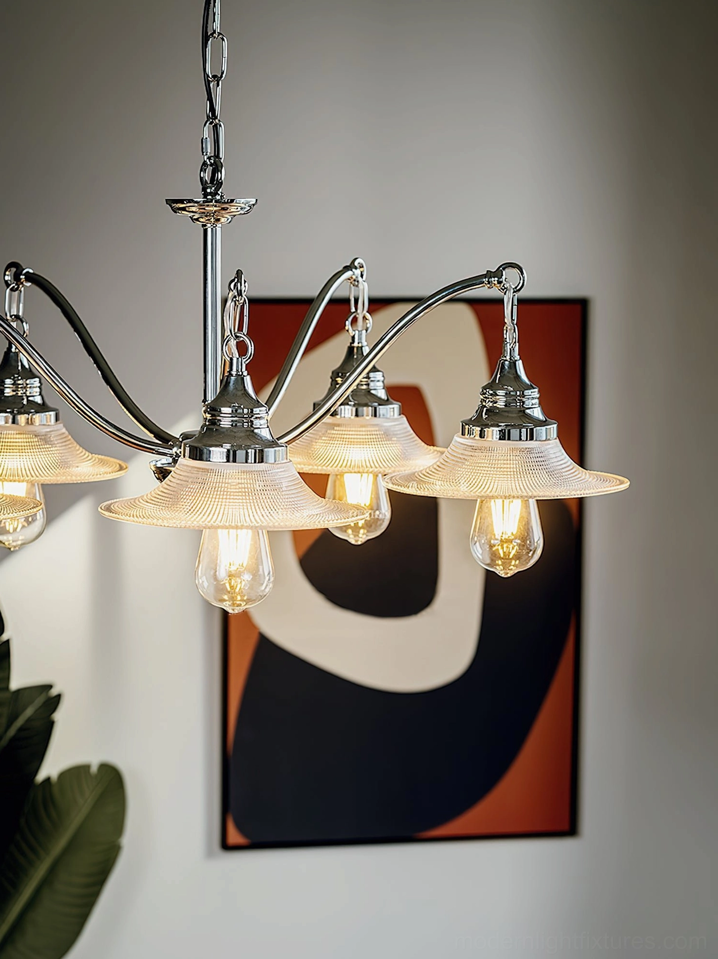 Chrome chandelier with ribbed glass shades showing light reflection and glow characteristics