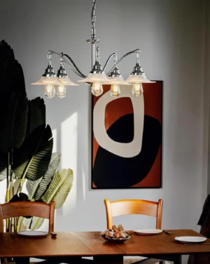 Modern dining room with 5-light vintage chrome chandelier creating warm ambient lighting over wooden table