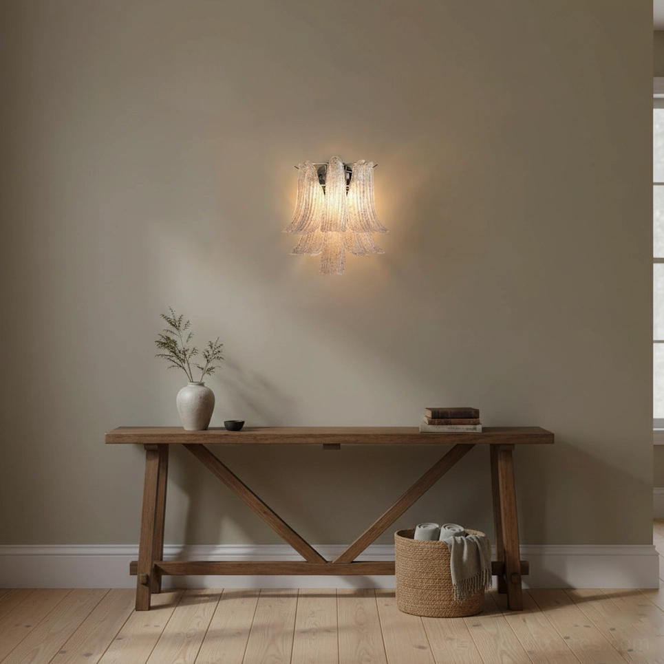 Chrome metal petal wall sconce showing artistic glass form and contemporary minimalist mounting design