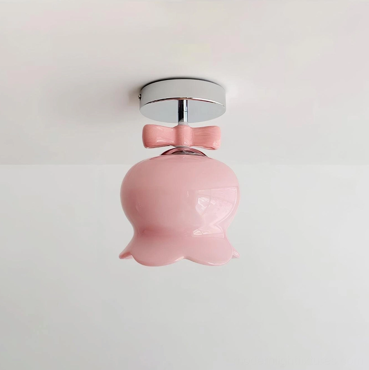 Chrome and pink variant bell ceiling light fixture highlighting metal base craftsmanship and pink glass shade diffusion properties