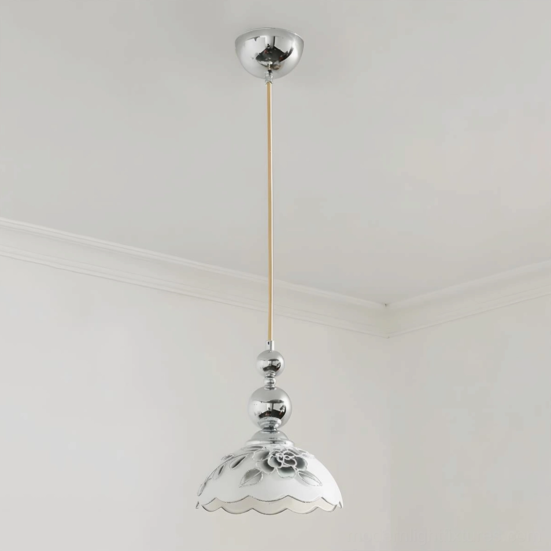 Chrome single pendant lamp with hand-painted floral glass shade and scalloped edge, minimalist interior