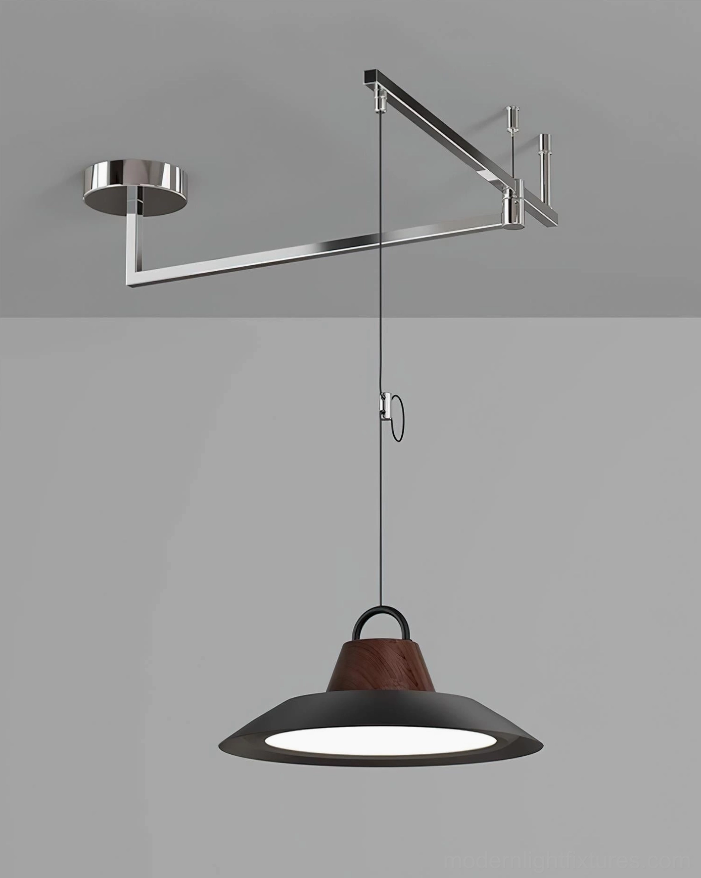 Polished chrome swing arm pendant lamp with black shade and walnut accent industrial modern display