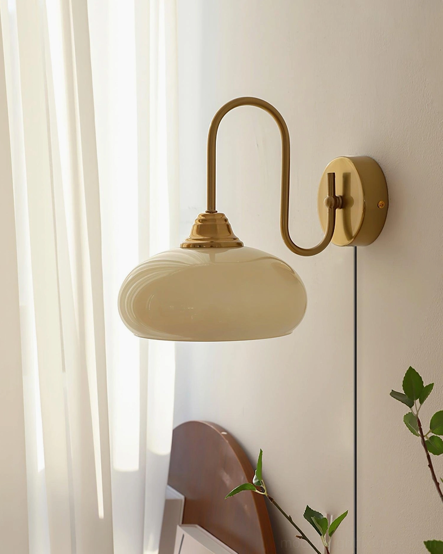 Chrome finish plug-in wall sconce with textured glass shade, paired installation on hallway wall creating ambient lighting
