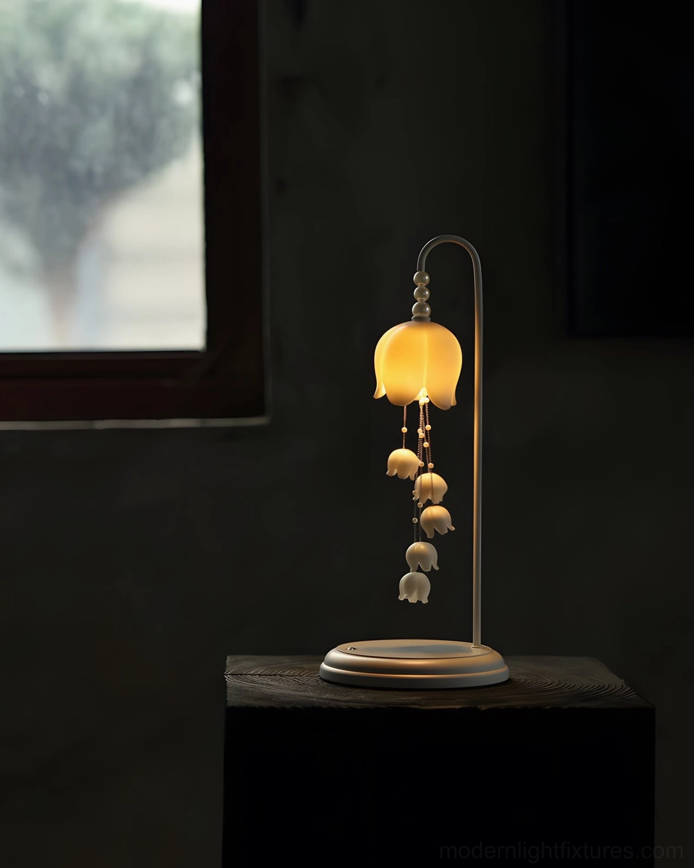 Chyme Charge modern table lamp glowing on dark accent table with ambient room lighting