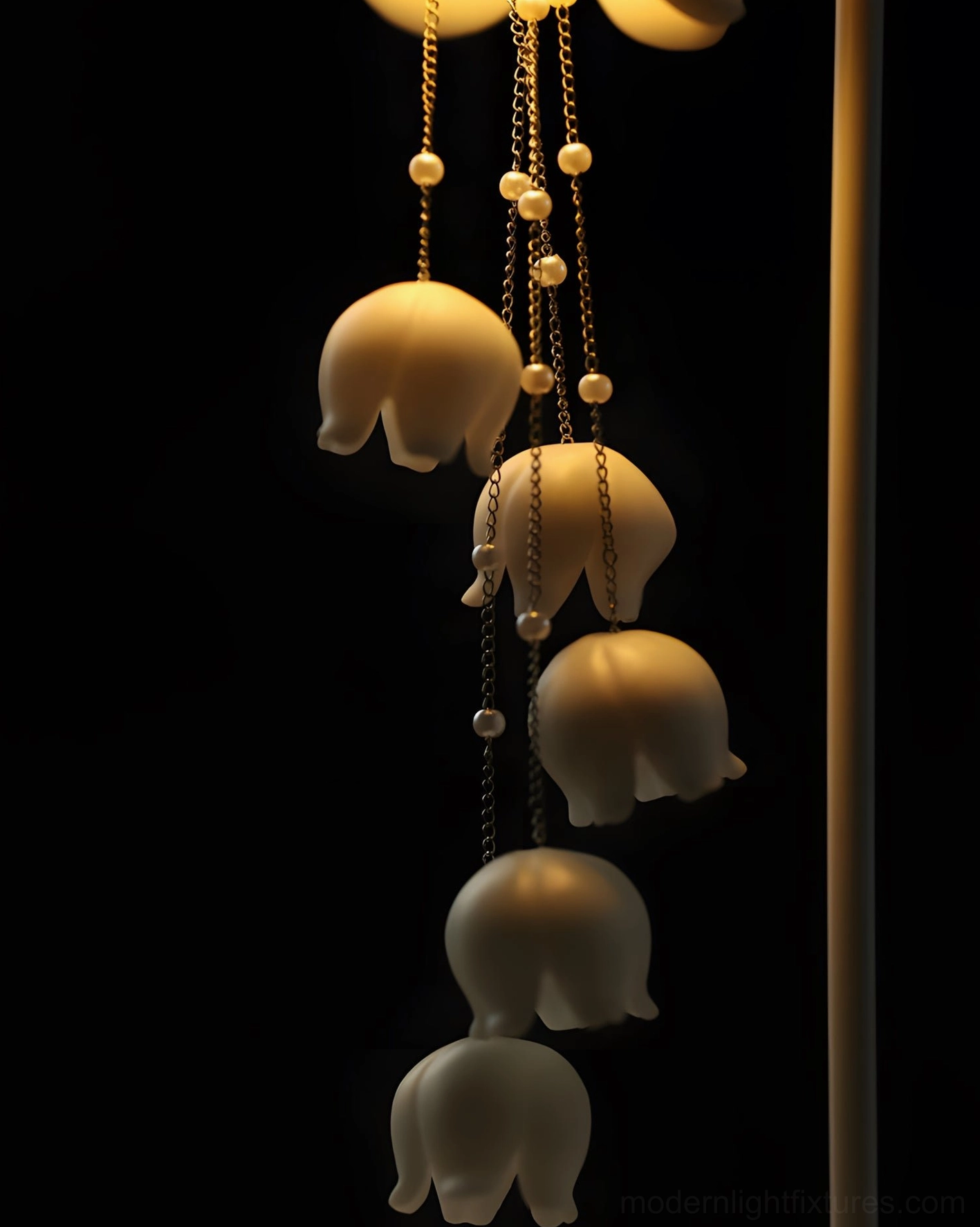 Close-up detail of Chyme Charge lamp showing beaded metal chains and matte ceramic flower pendants