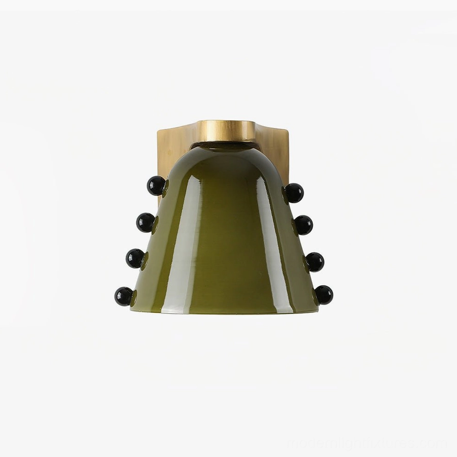 Green conical glass wall sconce with polished brass hardware and decorative black beads representing mid-century modern lighting aesthetic
