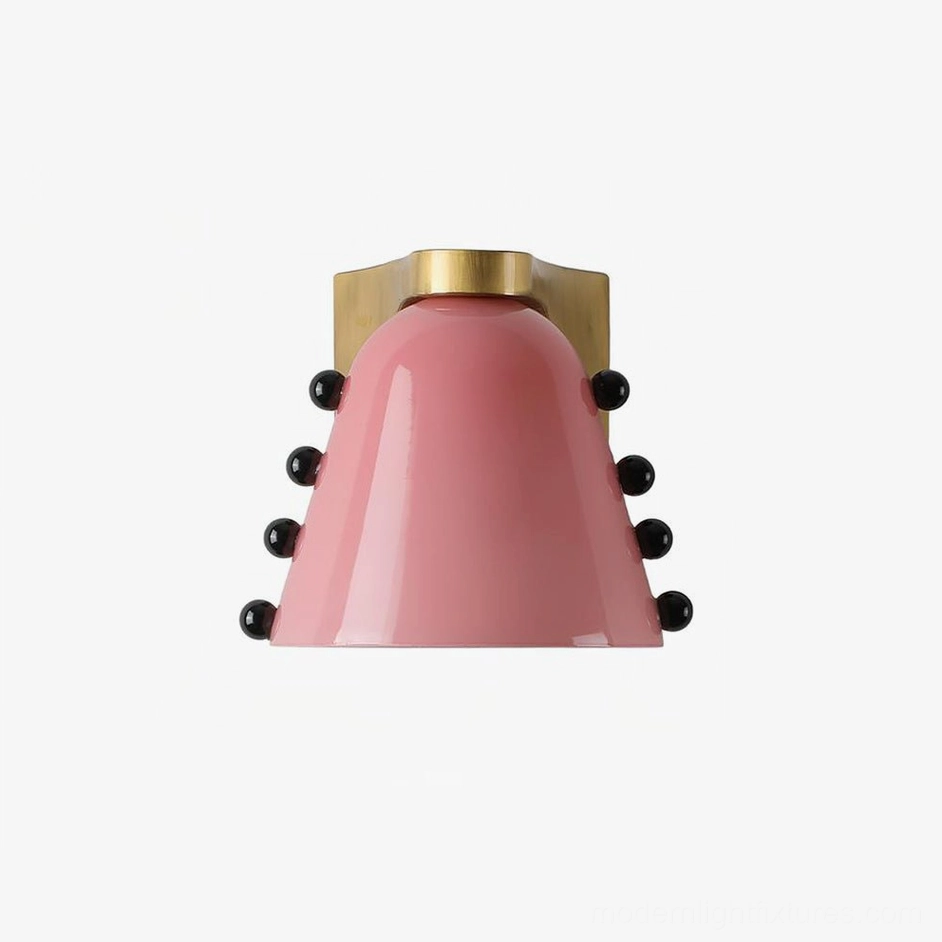 Pink conical glass wall sconce with brass base and decorative black bead accents showcasing retro luxury mid-century modern design