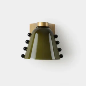 Cicero conical wall sconce with dark green glass shade and brass base featuring decorative black bead accents in frontal flat perspective
