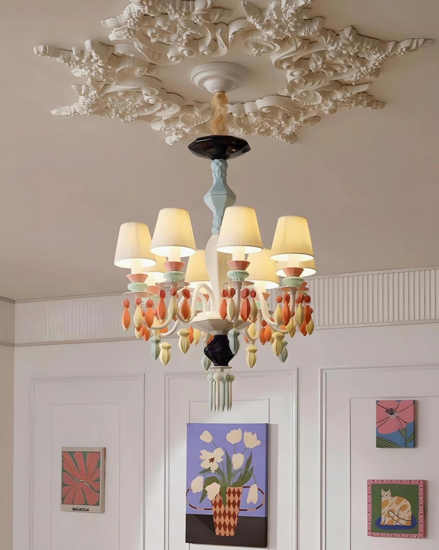 Cielora ceramic chandelier angled front view in French residential room with wall artworks and decor
