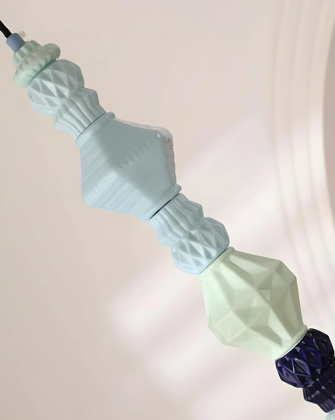 Hand-crafted ceramic totem pendant light detail showing glaze depth and artisanal finish, modern fixture