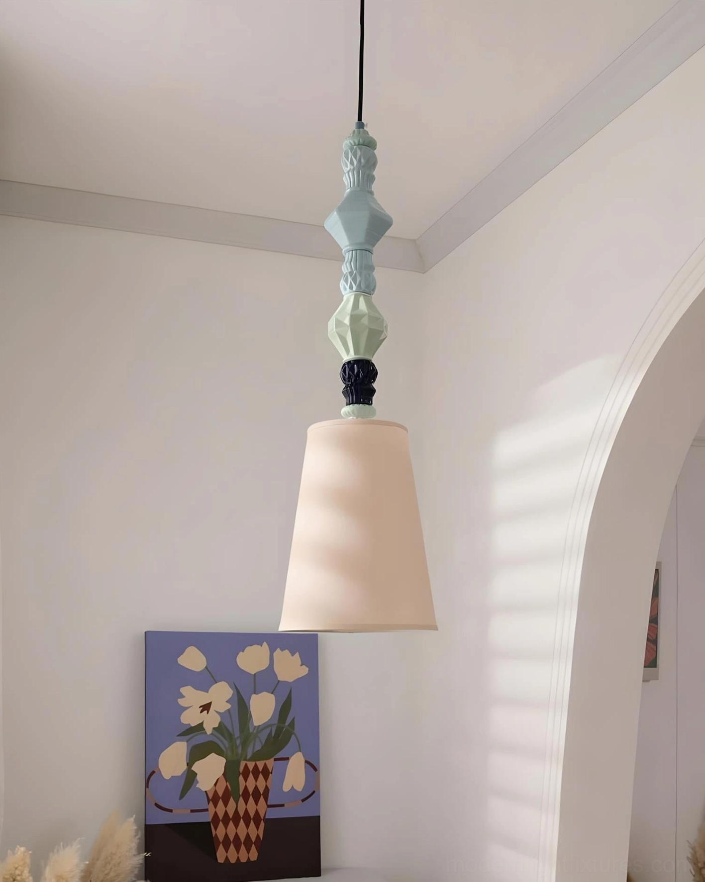 Cielora ceramic totem pendant light in eclectic modern bedroom space, playful artistic focal point ceiling fixture