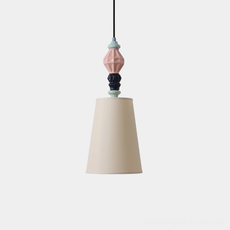 Cielora ceramic totem pendant light with pastel geometric colored top and off-white conical fabric shade, front studio shot on white background