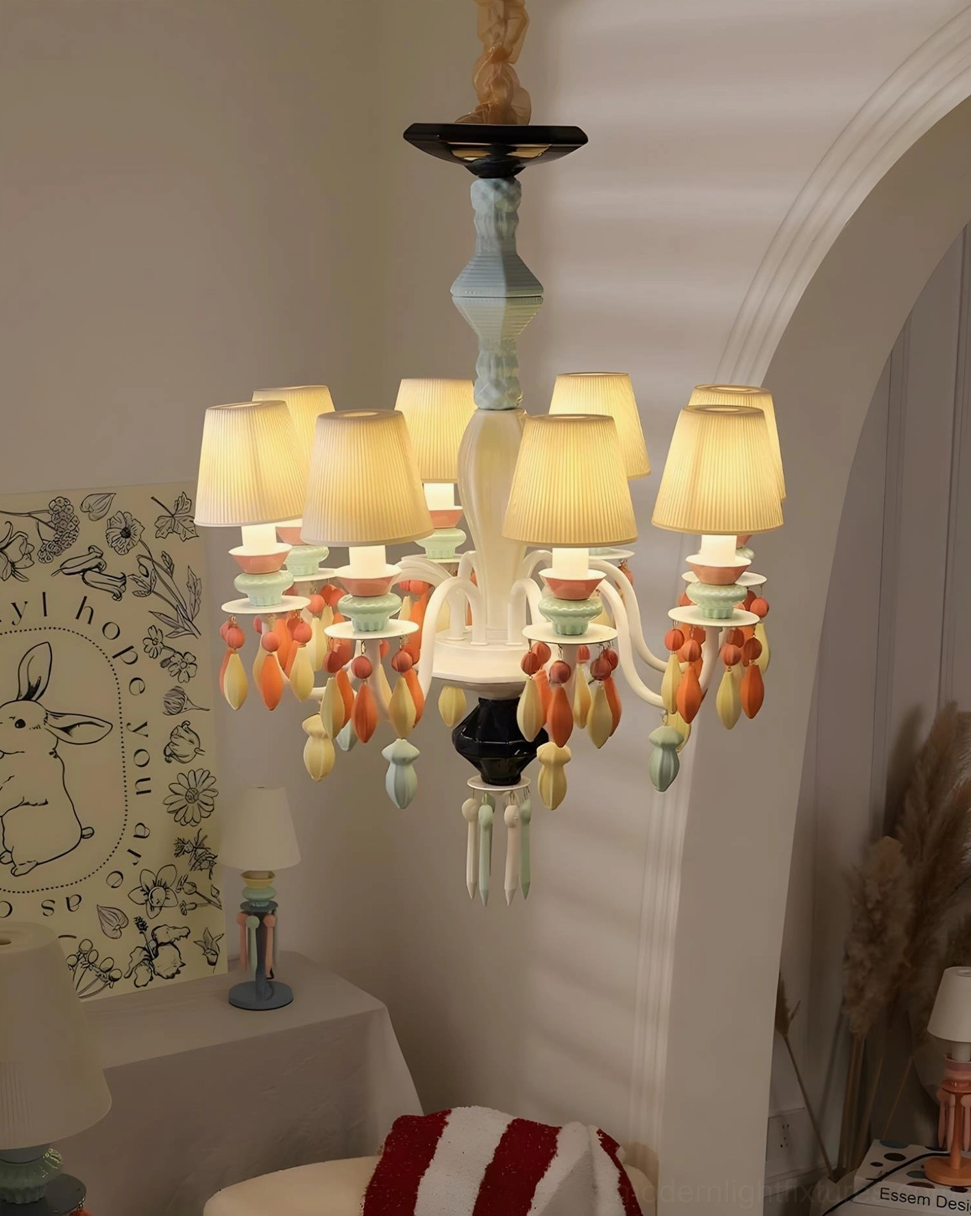 Cielora warm-toned ceramic chandelier close-up eye-level with illuminated fabric shades in cozy bedroom