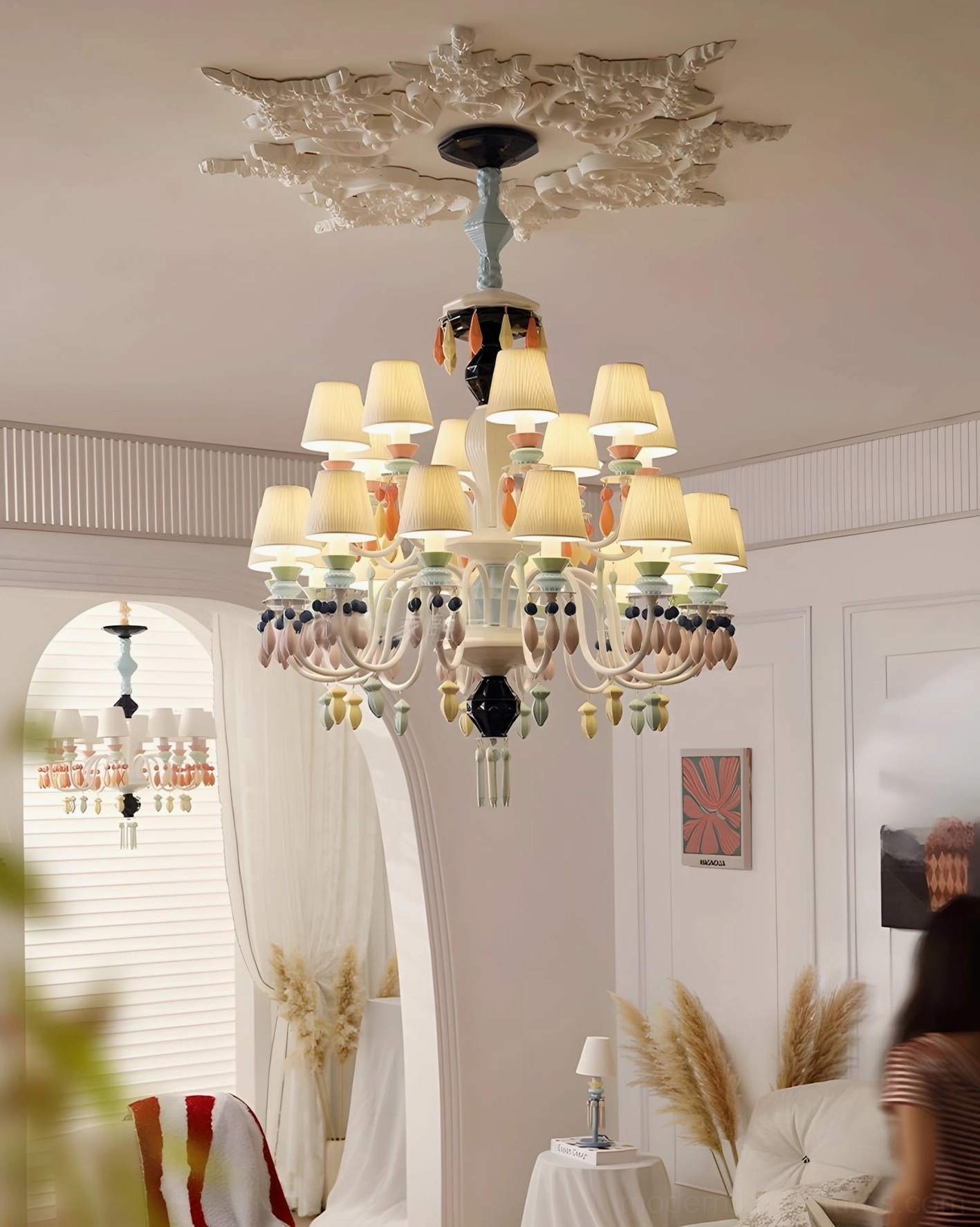 Cielora ceramic chandelier installation detail showing hanging chain adjustment and ceiling mounting