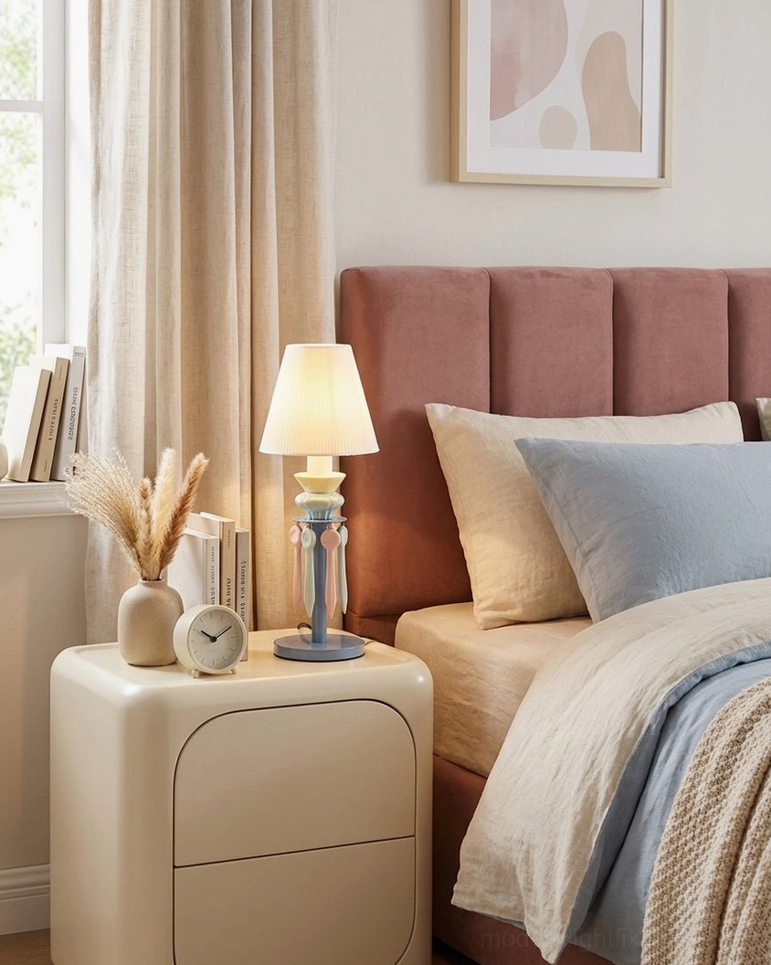 Cielora pastel tassel table lamp on bedside table creating soft glow in bedroom with pink upholstered bed frame