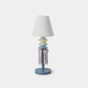 Cielora pastel tassel table lamp with pleated fabric shade and ceramic base featuring hand-finished decorative tassel accents, front studio view