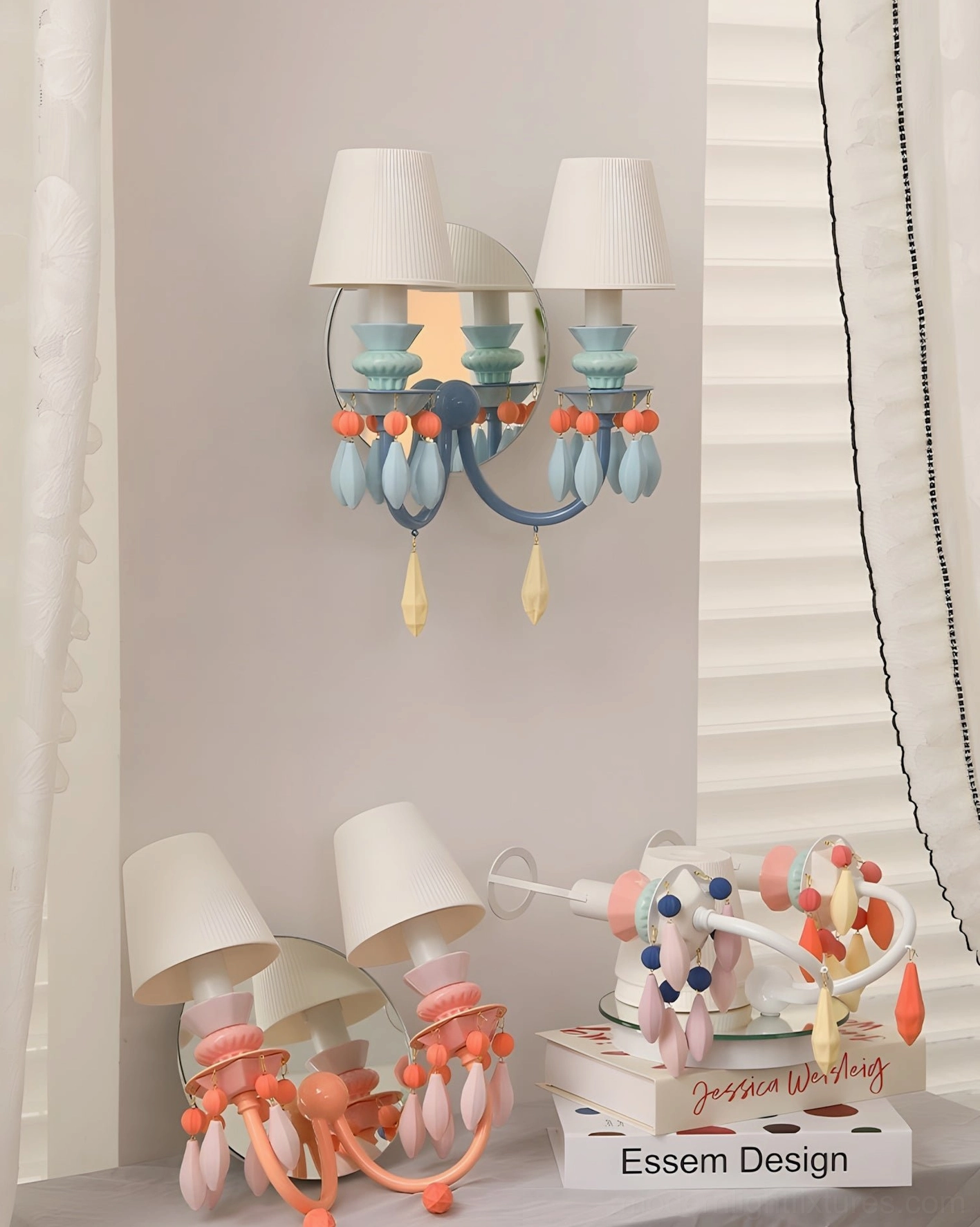 Dual-head ceramic bead wall sconce Cielora with blue orange pastel tones styled on bedroom shelf with books and decorative accessories
