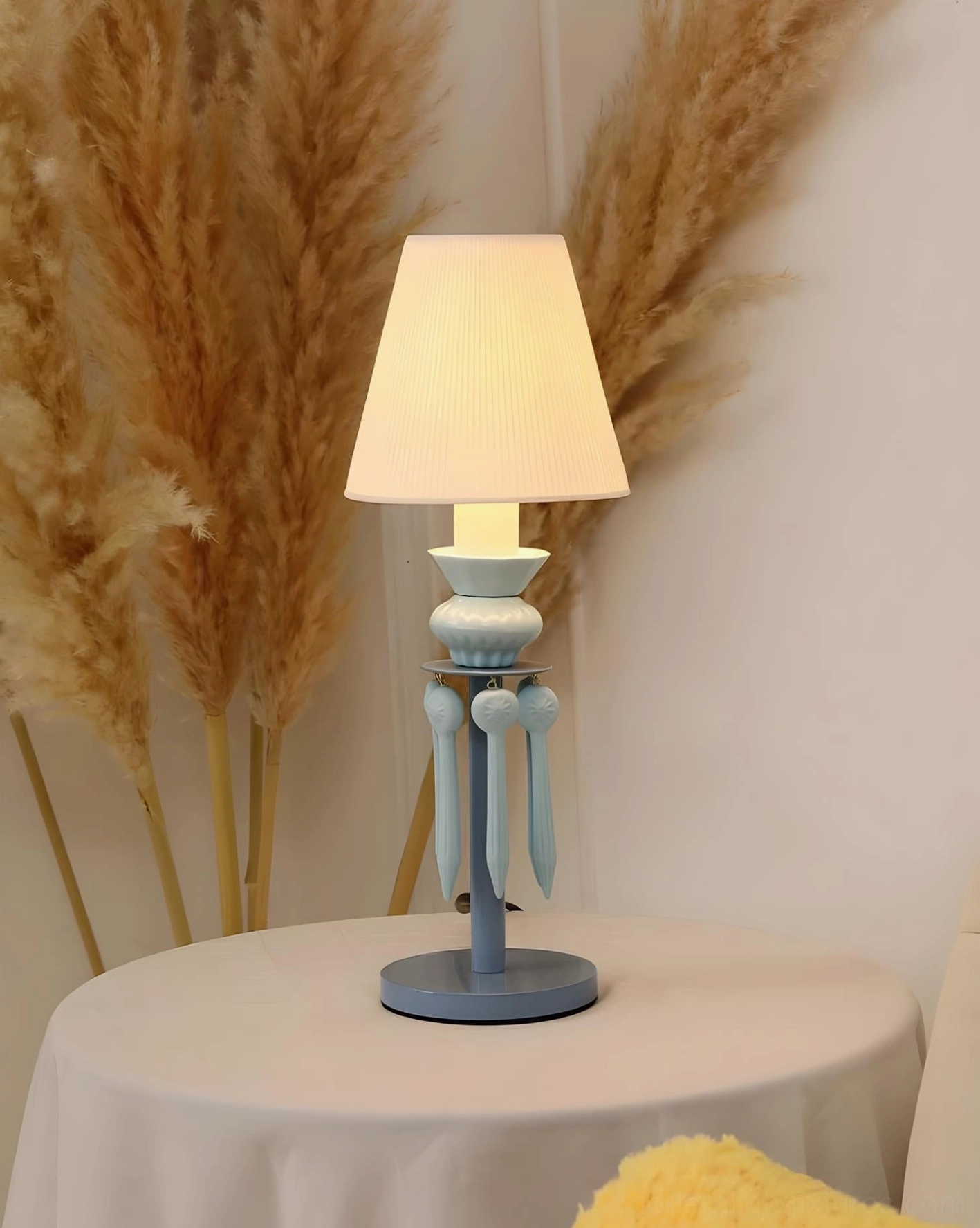 Cielora tassel table lamp close-up showing fine pleated fabric shade construction and light reflection quality