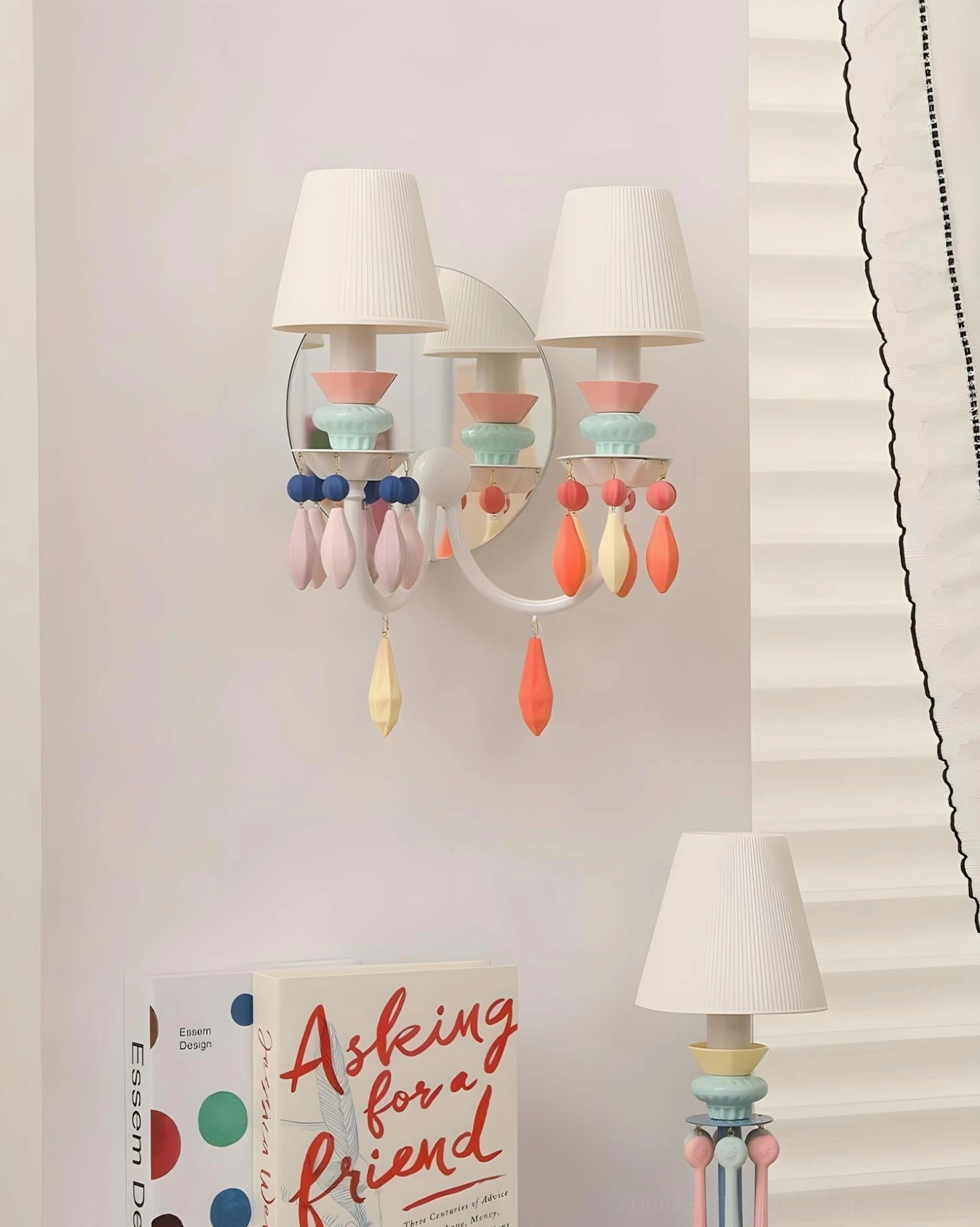 Cielora wall sconce with purple-pink ceramic beads in unlit bedroom scene showing sculptural ceramic arrangement and soft pleated shades
