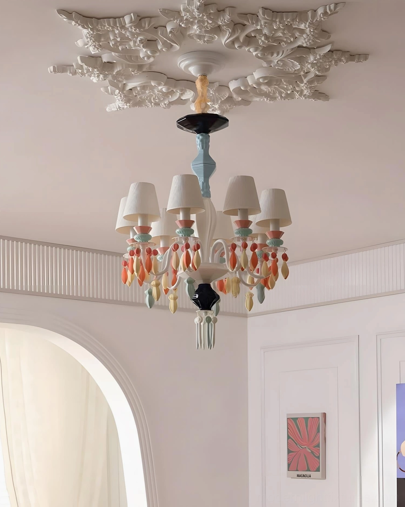 Warm-toned multicolor ceramic chandelier eye-level view in minimalist French-style bedroom with ornate ceiling