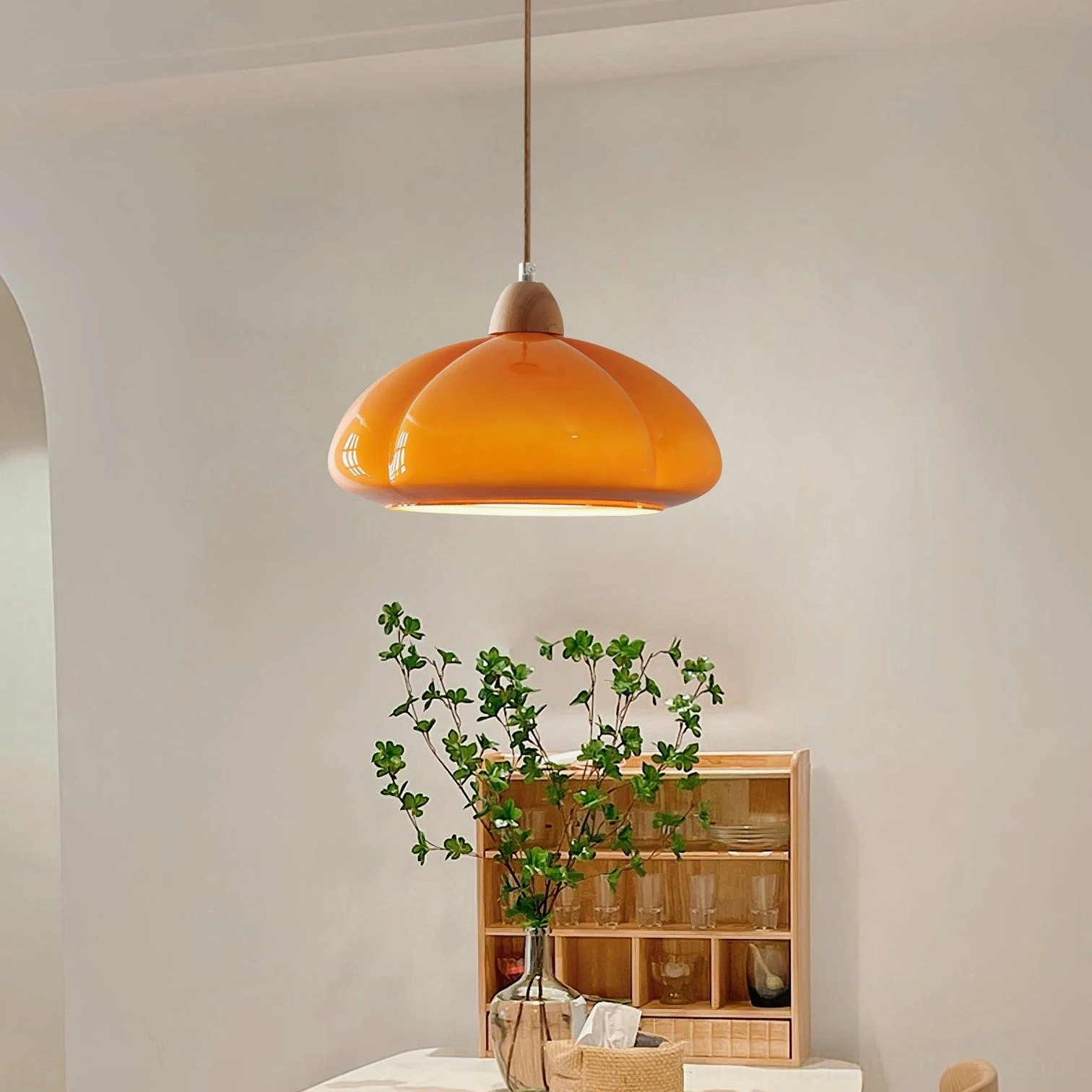 Cipola warm orange mushroom pendant light creating focal point in modern kitchen island
