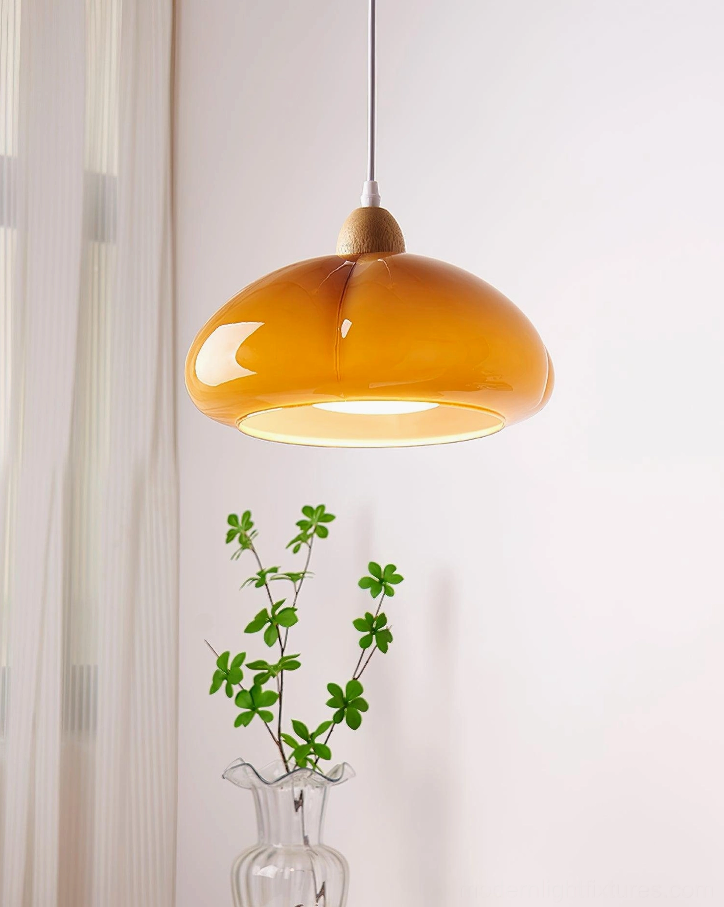 Cipola pumpkin-shaped pendant lamp with warm ambient lighting in residential bedroom nook